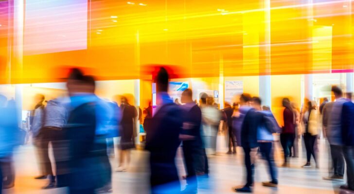 Overexposed picture of people in a city.