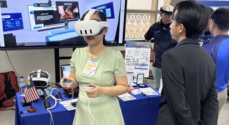 Woman wearing VR glasses at an exhibition.