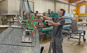 Shaping stone by hand and machine